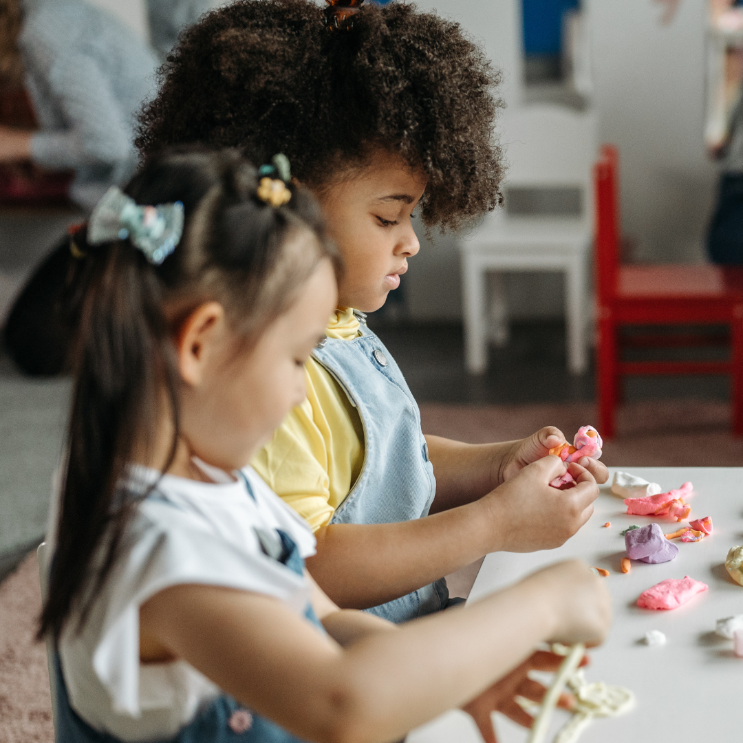 2 children playing at table