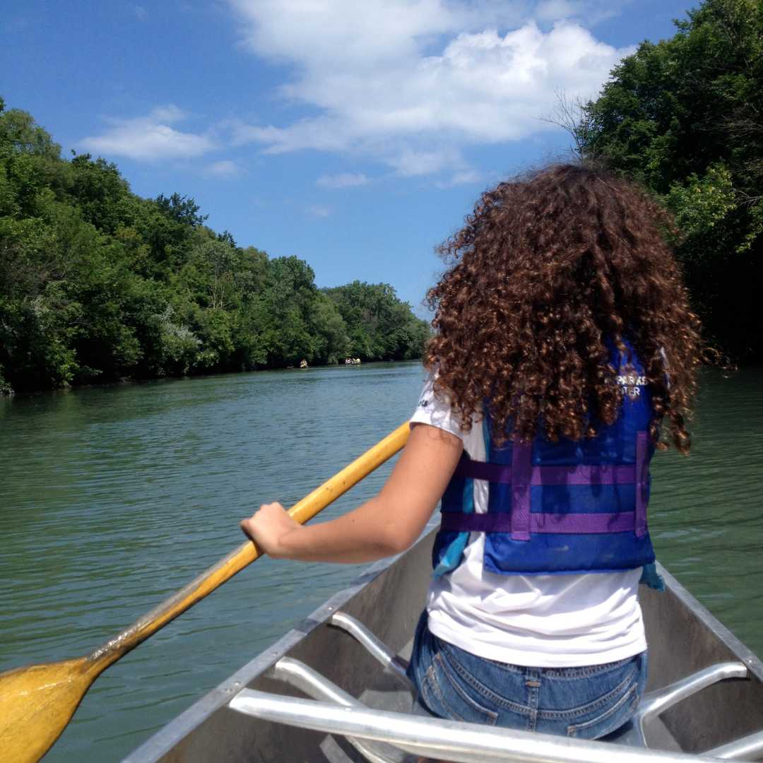 Girl in canoe on North Shore Canal