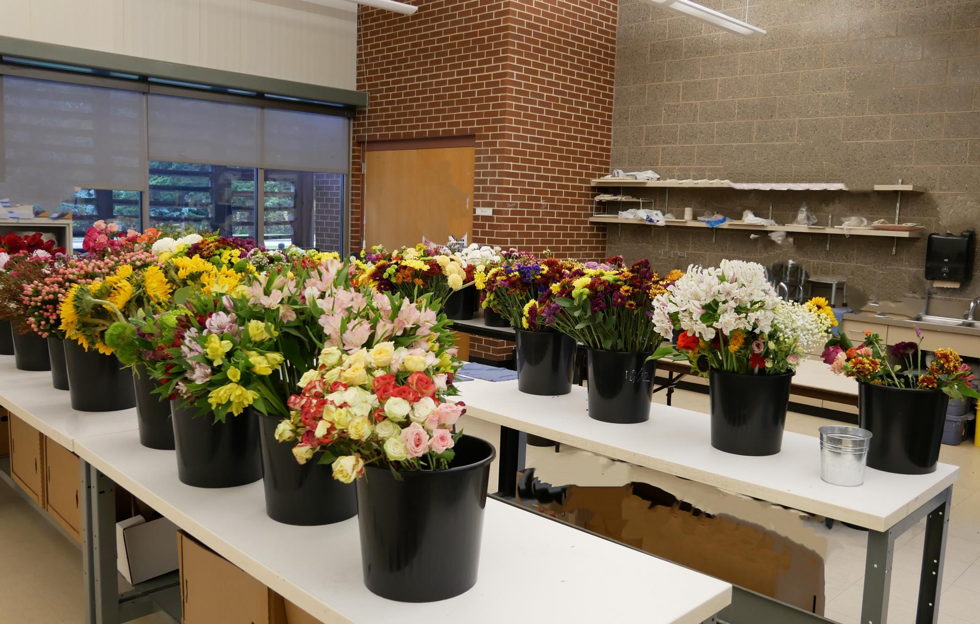 Levy Art Room with flower arrangements on the art tables