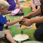 child with turtles